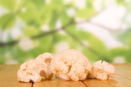 Inflorescence of cauliflower on abstract green background.の写真素材