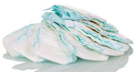 A pile of clean disposable diapers and isolated on white background.の写真素材