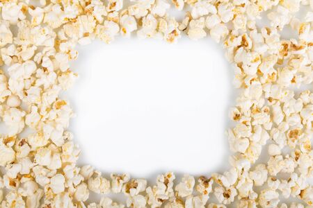 The frame is made of popcorn isolated on white background.の写真素材