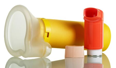 The inhaler and aerochamber isolated on white background.の写真素材