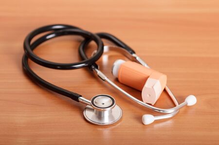 Medical phonendoscope and device for inhalation, against  background of tableの写真素材