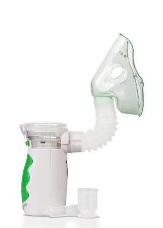 Electronic mesh inhaler, with child's mask, isolated on white backgroundの写真素材