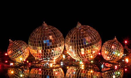 Big and small Christmas balls with mirror surface isolated on  black backgroundの写真素材