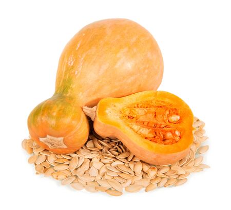 Whole ripe pumpkin, half and seeds isolated on white background.の写真素材