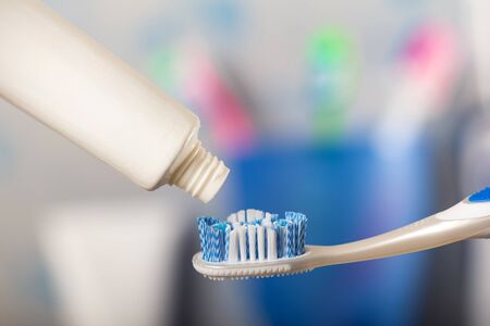 Toothbrush and tube with paste, close-upの写真素材