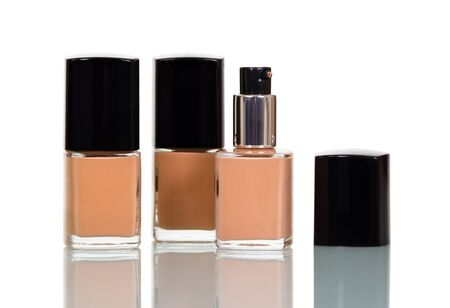 Small vials with tonal creams, for makeup, isolated on white backgroundの写真素材
