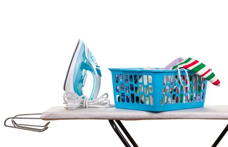Electric iron and box with linen on Ironing Board, isolated on white backgroundの写真素材
