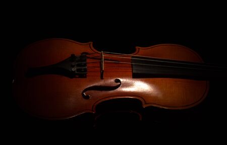 Music string instrument violin isolated on black backgroundの写真素材