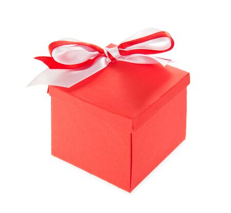 Big gift box with bright bow isolated on white backgroundの写真素材