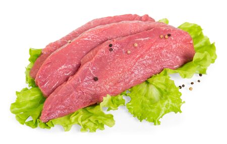 Pieces of fresh veal with spices and salad leaves isolated on white backgroundの写真素材