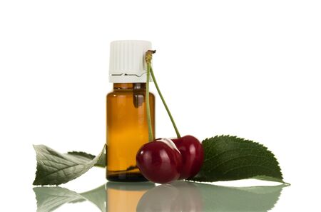 Aromatic liquid for inhalation vapor electronic cigarettes next two cherries isolated on white backgroundの写真素材