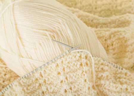 Akein of thread, knitting needles and finished canvas. Backgroundの写真素材