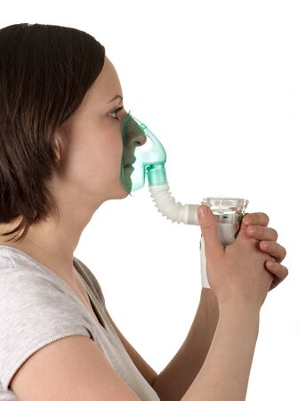 Nebulizer for inhalation in woman hands isolated on white backgroundの写真素材