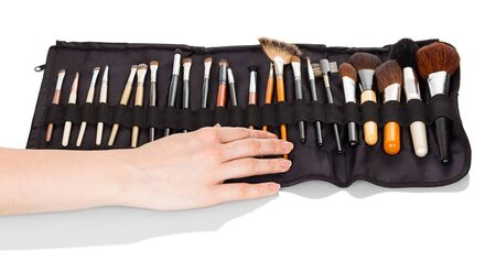 Set of different brushes for make-up in special case, isolated on white backgroundの写真素材