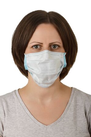Woman in disposable medical protective mask isolated on white backgroundの写真素材