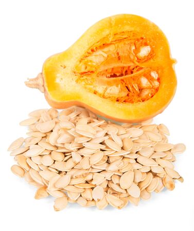 Piece pumpkin, next of pumpkin seeds isolated on white backgroundの写真素材