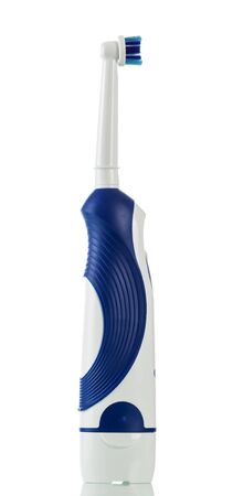 The subject of hygiene - electric toothbrush, isolated on white backgroundの写真素材