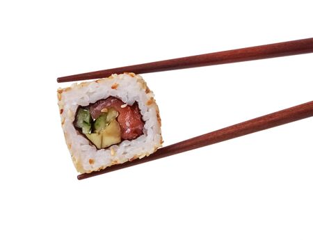 Traditional Japanese sushi roll in wooden chopsticks isolated on white backgroundの写真素材