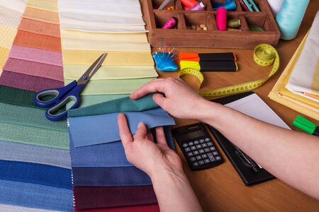 Samples of fabrics, sewing accessories, calculation and design of clothingの写真素材