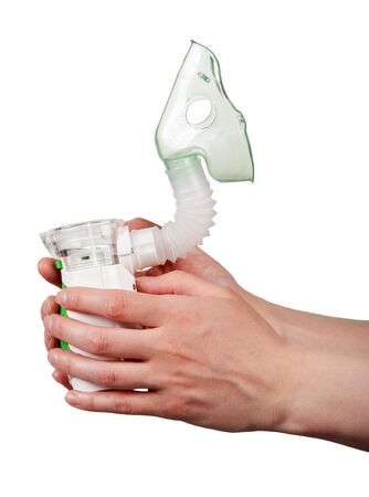 Electronic mesh nebulizer in hands isolated on white backgroundの写真素材