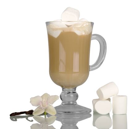 Glass with cappuccino, near pieces of marshmallow, vanilla and Orchid flower isolated on white backgroundの写真素材