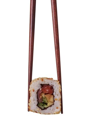 Sushi roll in chopsticks isolated on white backgroundの写真素材