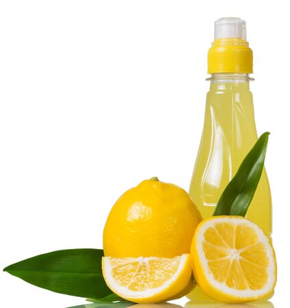 Bottle of lemon juice and fruit isolated on white backgroundの写真素材