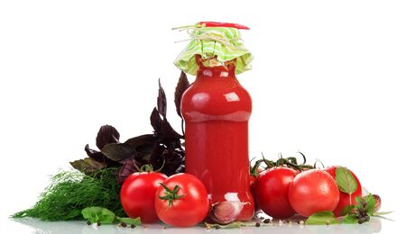 Fresh tomatoes, juice bottle, herbs and spices isolated on white background.の写真素材