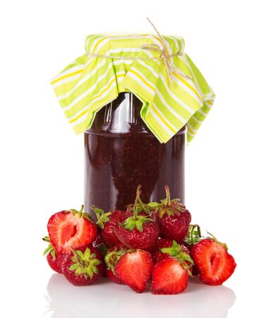 Jar of strawberry jam and strawberry beside isolated on white background.の写真素材