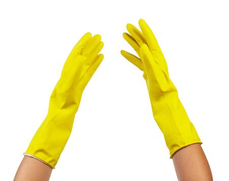 Hands in yellow rubber gloves isolated on white background.の写真素材