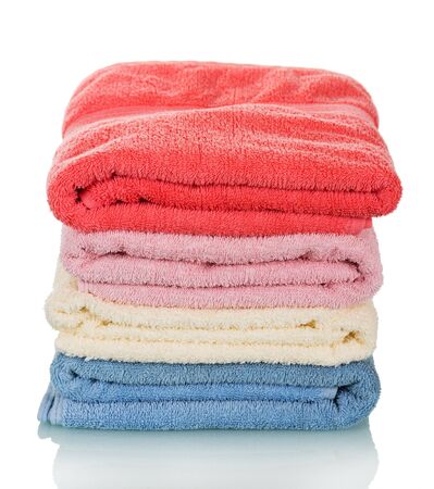 A stack of clean towels ironing isolated on white background.の写真素材
