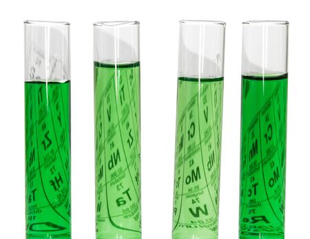 Test tubes with fluid and the periodic table isolated on white background.の写真素材