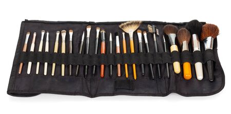 A set of cosmetic brushes for makeup in its case isolated on white background.の写真素材