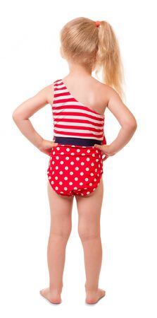 Little blond girl in swimsuit, rear view isolated on white background.の写真素材