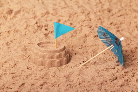 Coliseum sand, flag and umbrella closeup. Backgroundの写真素材