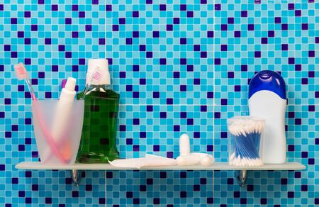 Shelf with feminine hygiene products in the bathroom on the abstract blue background.の写真素材