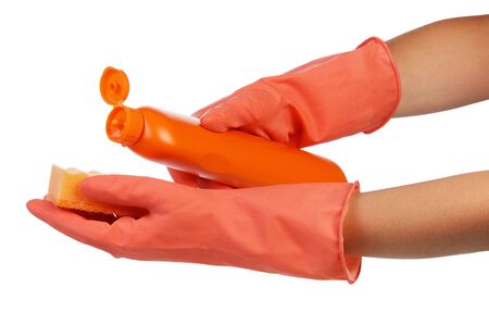 Hands in gloves holding sponge and a bottle of detergent isolated on white background.の写真素材