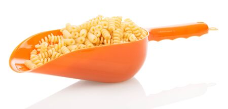 Scoop with helical pasta isolated on white background.の写真素材