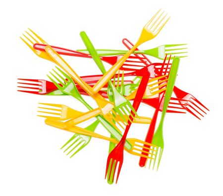 Pile of colorful plastic forks closeup isolated on white background.の写真素材