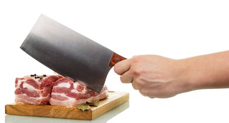 Raw pork meat, cutting board and a human hand holding a a cutter isolated on white background.の写真素材