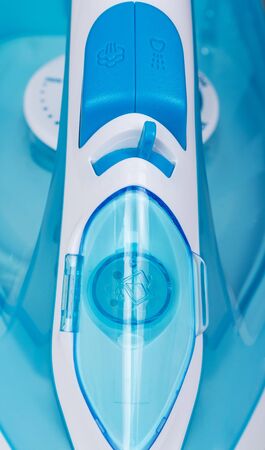 Modern steam iron closeup. View from above. Backgroundの写真素材
