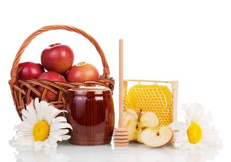 Basket with red apples, honey comb and a keg, ladle isolated on a white background.の写真素材