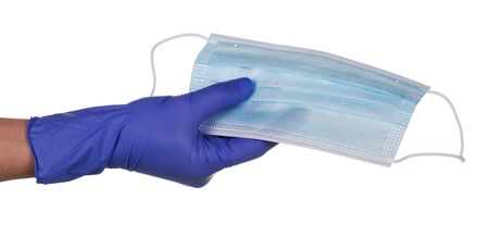 Coronavirus prevention concept. Hand with latex glove and medical mask isolated on white background.の写真素材