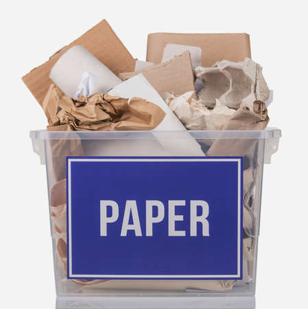 Recycling concept. Cardboard and recyclable paper in a container with the inscription paper isolated on white backgroundの写真素材