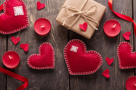 Valentine's day card. Hearts, boxes and ribbons on a background of boards. Top viewの写真素材