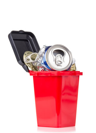 Red trash can and metal household waste isolated on white background