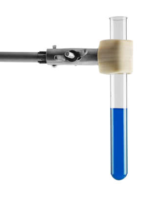 Laboratory chemical equipment. Test tube with blue liquid in tripod leg isolated on white backgroundの写真素材