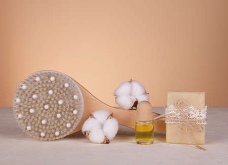 SPA. Relax. Body brush, handmade soap and aroma oil on a light background