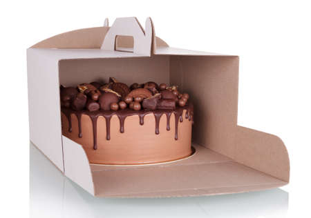Delicious chocolate cake in takeaway cardboard box isolated on white backgroundの写真素材