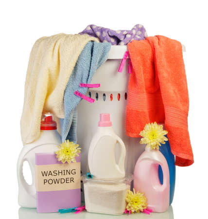 Full basket with dirty laundry and detergents isolated on white backgroundの写真素材